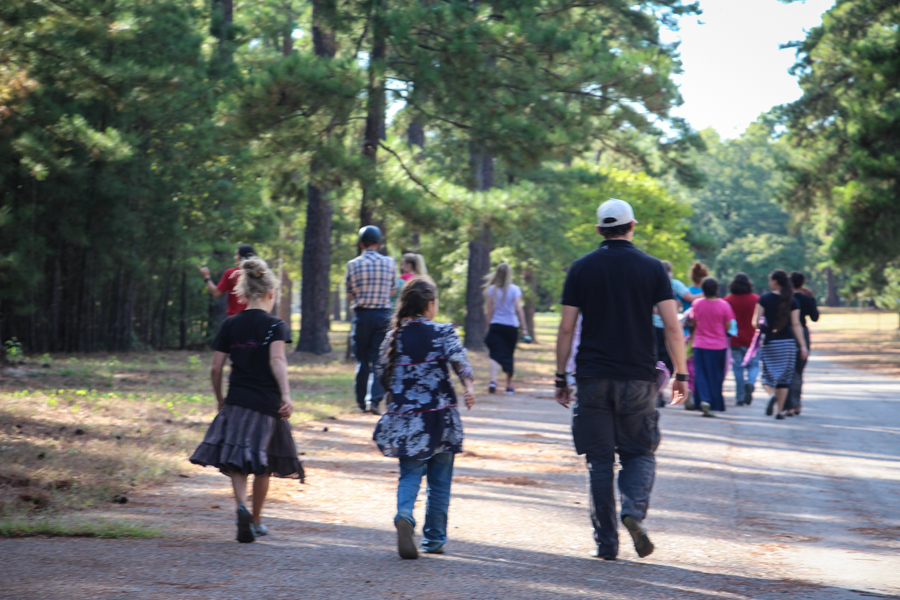 Families walking the golden path at the Feast